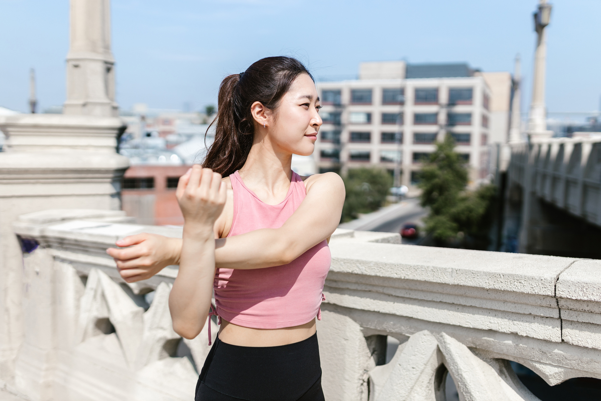 A Woman in Pink Tank Exercising